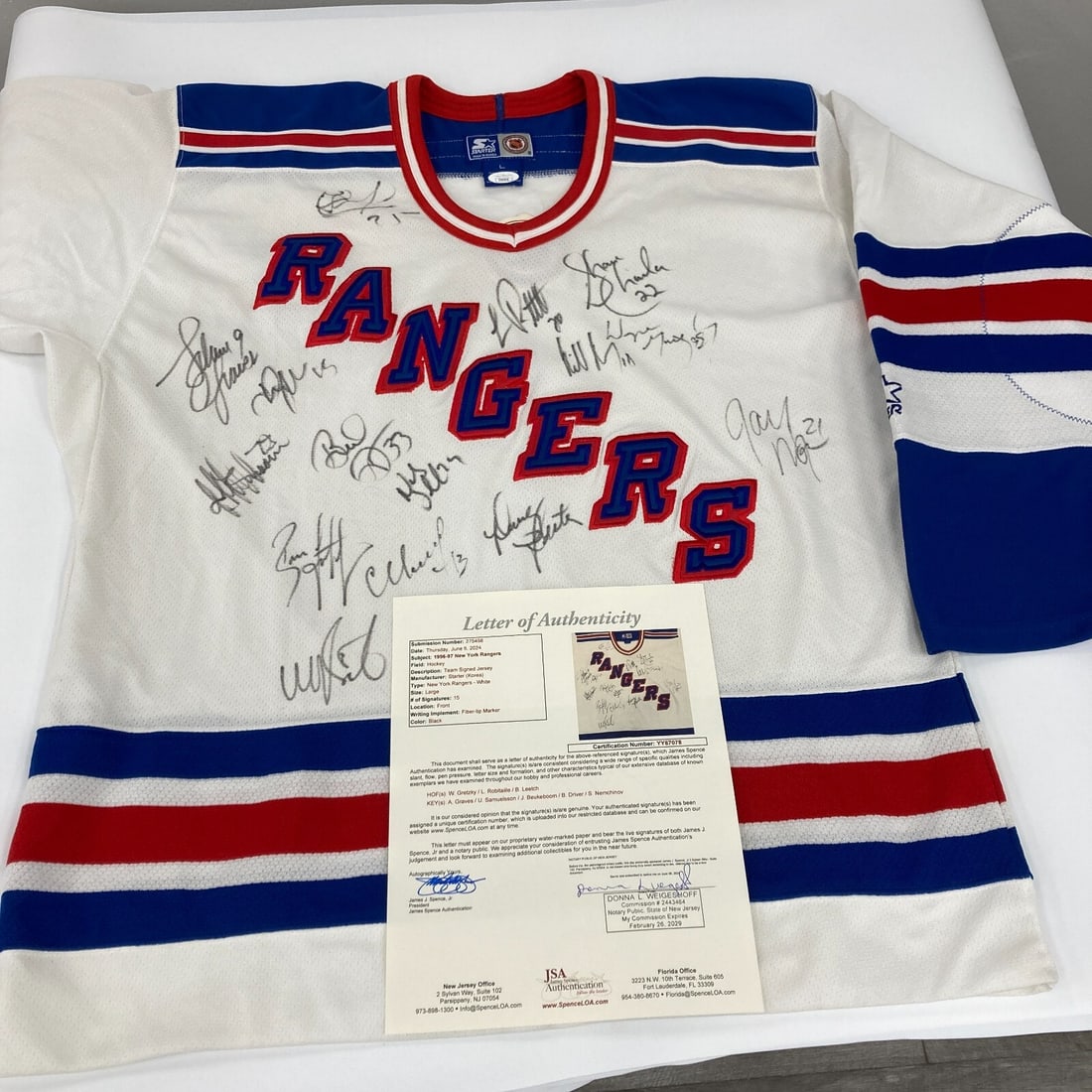 Wayne Gretzky 1996-1997 New York Rangers Signed Jersey JSA COA: Wayne Gretzky 1996-1997 New York Rangers Signed Jersey JSA COA This is a remarkable 1996-1997 New York Rangers team-signed jersey, featuring the iconic Wayne Gretzky along with fourteen other team mem
