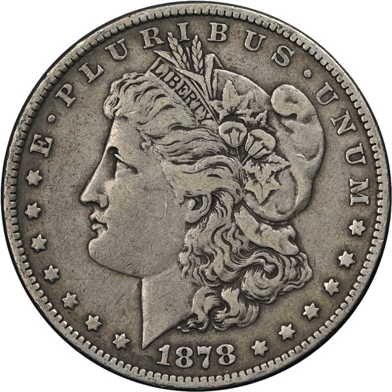 1878-P Morgan Silver Dollar 7TF Rev 79 Circulated: 1878-P Morgan Silver Dollar 7TF Rev 79 Circulated This is a 1878-P Morgan Silver Dollar featuring the 7 Tail Feathers Reverse of 1879 variety. The coin is composed of 90% silver and was minted in Phil