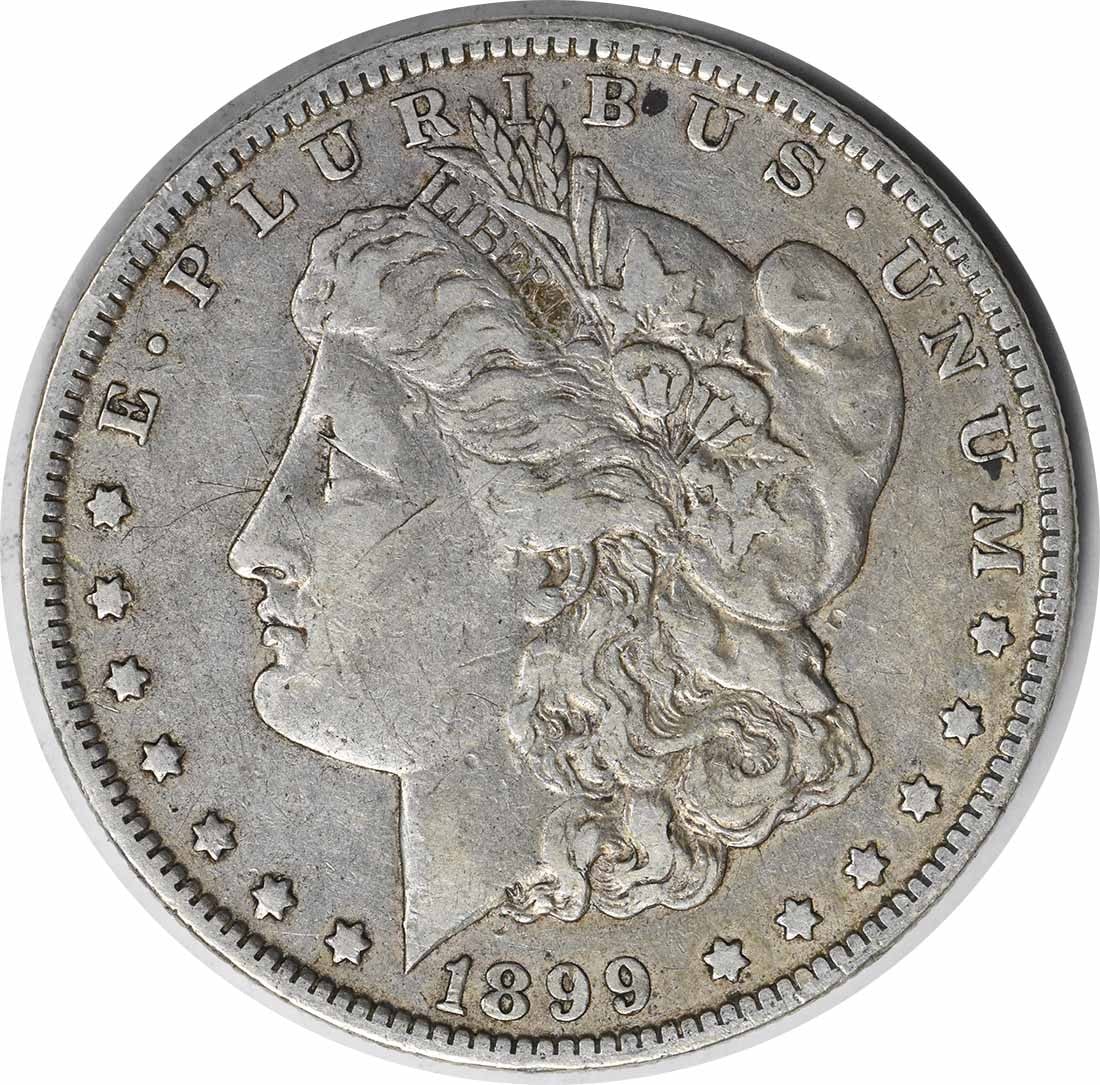 1899 VAM 6 Morgan Silver Dollar Micro O 90% Silver Uncertified: 1899 VAM 6 Morgan Silver Dollar Micro O 90% Silver Uncertified This 1899 VAM 6 Morgan Silver Dollar showcases a rich history with its distinctive micro 'O' mint mark from the New Orleans mint. Crafted