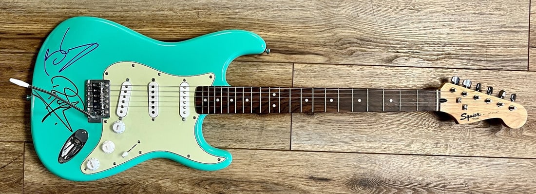 Brian May Roger Taylor Signed Aqua Fender Squire Stratocaster Guitar: Brian May Roger Taylor Signed Aqua Fender Squire Stratocaster Guitar This stunning Aqua Fender Squire Stratocaster guitar is a rare collectible, beautifully signed by legendary Queen band members