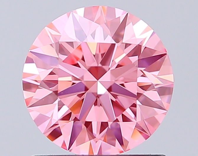 Ideal Loose Diamond - ROUND 1.1ct Fancy Vivid Pink VS1: Ideal Loose Diamond - ROUND 1.1ct Fancy Vivid Pink VS1 Source: This is a real non-mined Diamond that has been grown in a lab Shape: ROUND Carats: 1.1 Color: Fancy Vivid Pink Certification: IGI Video: