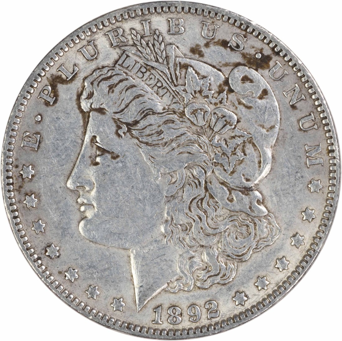 1892 Philadelphia Morgan Dollar 90 Percent Silver Extra Fine Uncertified: 1892 Philadelphia Morgan Dollar 90 Percent Silver Extra Fine Uncertified This is an 1892 Morgan Silver Dollar from the United States, designed by George T. Morgan. The coin is composed of 90% silver a