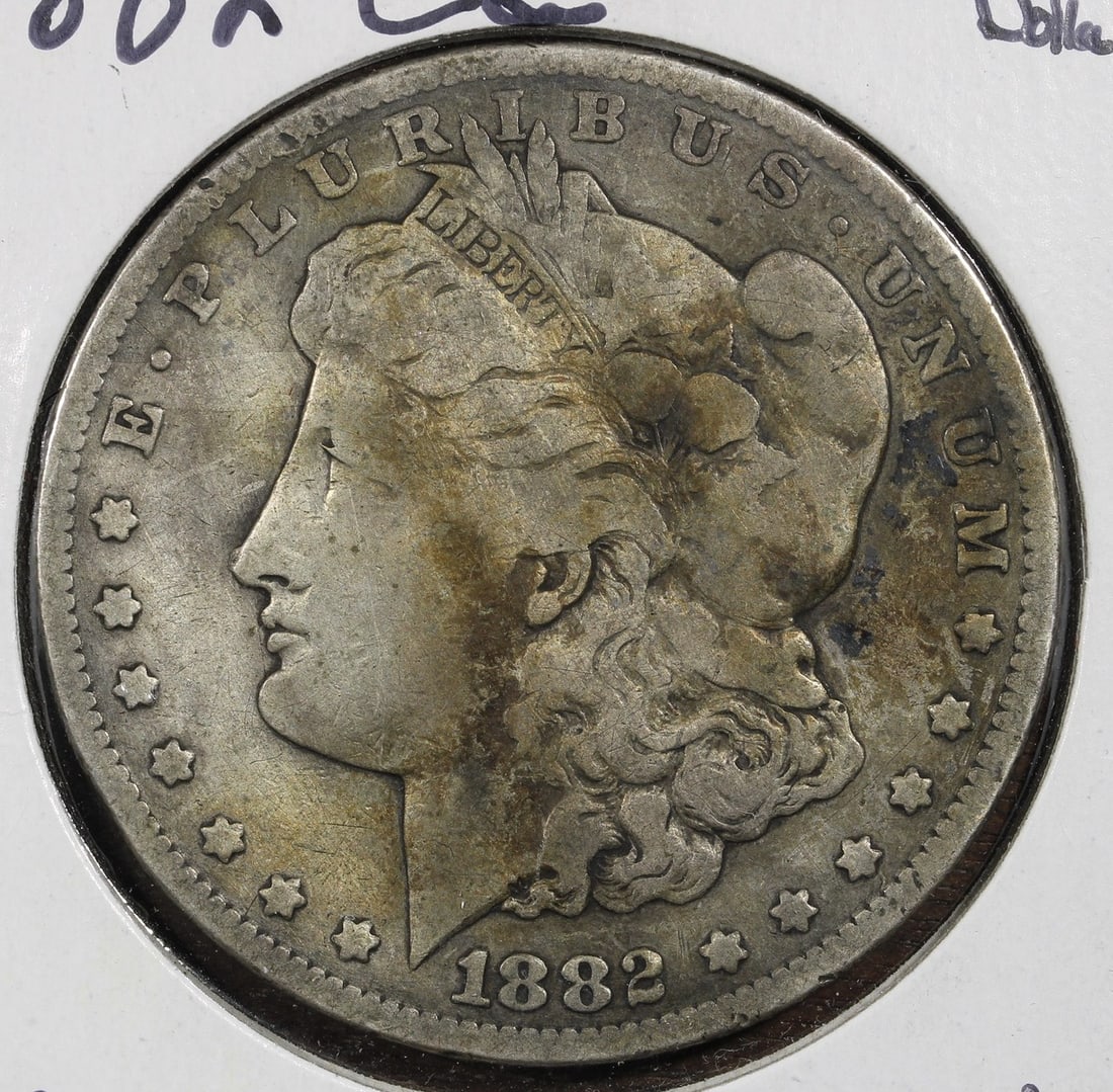 Carson City Morgan Silver Dollar 1882-CC $1: Carson City Morgan Silver Dollar 1882-CC $1 This is an 1882 Morgan Silver Dollar minted in Carson City. The coin is composed of 90% silver and has been circulated. It is ungraded and uncertified, maki