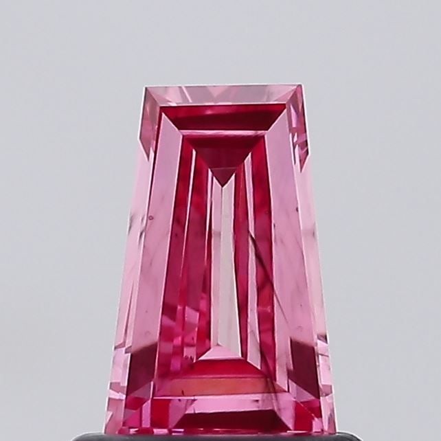 Loose Diamond - TAPERED BAGUETTE 0.57ct Fancy Vivid Pink SI1: Loose Diamond - TAPERED BAGUETTE 0.57ct Fancy Vivid Pink SI1 Source: This is a real non-mined Diamond that has been grown in a lab Shape: TAPERED BAGUETTE Carats: 0.57 Color: Fancy Vivid Pink Certific