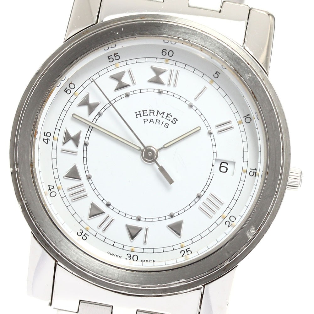 Hermes Carrick Date Quartz Stainless Steel Unisex Watch CA1.510: Hermes Carrick Date Quartz Stainless Steel Unisex Watch CA1.510 This Hermes Carrick Date Quartz wristwatch features a stainless steel case and bracelet with a white dial. Designed for unisex wear, the
