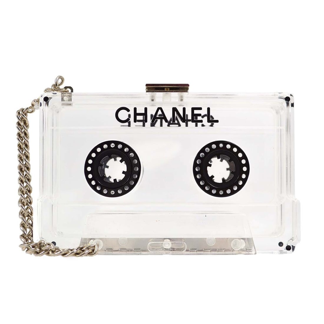 Mini Cassette Tape Clutch by Chanel Clear Acrylic 04P Collection: Mini Cassette Tape Clutch by Chanel Clear Acrylic 04P Collection This Chanel mini clutch bag features a unique clear acrylic design inspired by a cassette tape. Crafted in Italy, it is accented with a