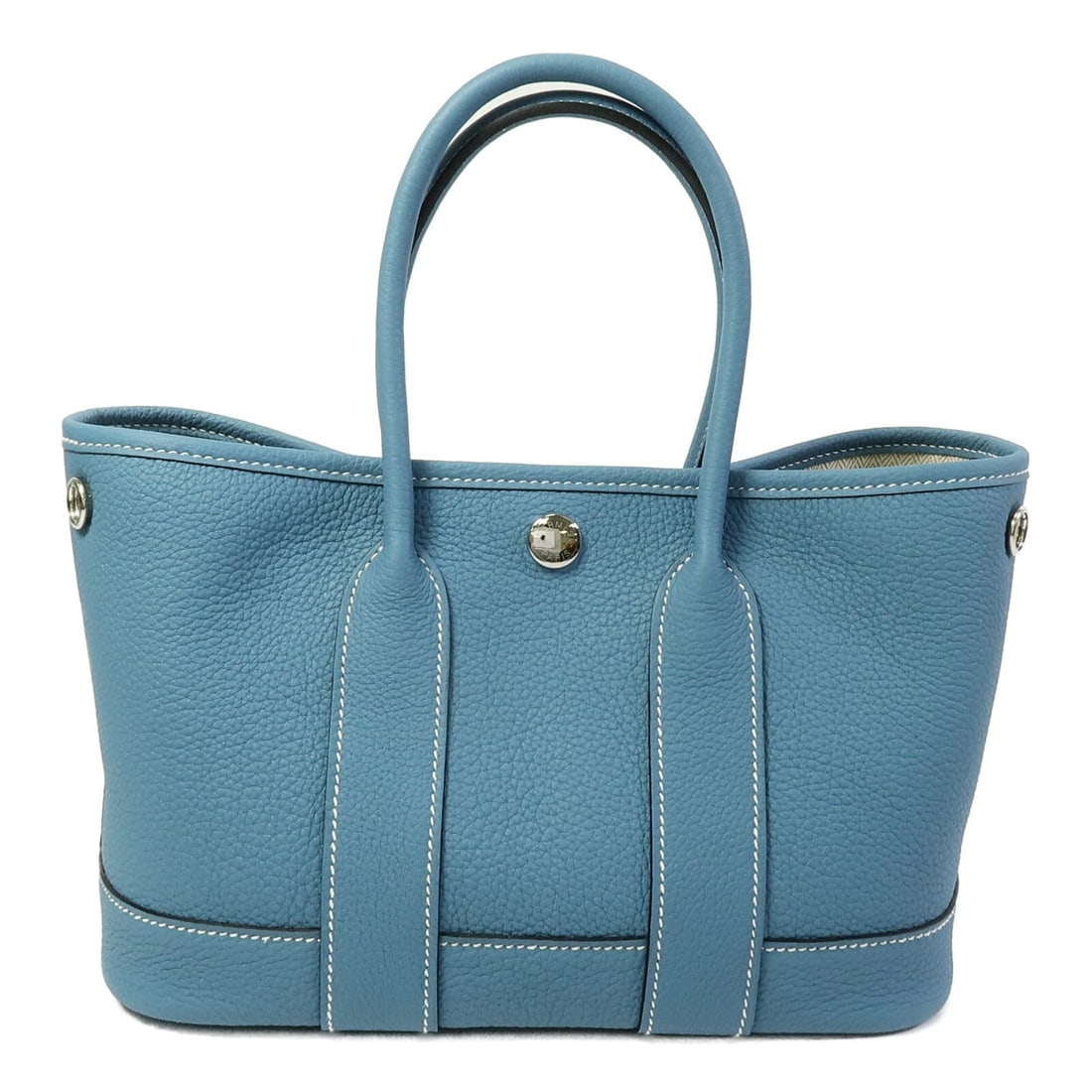 Hermes Mini Garden Party Blue Jean Calfskin Handbag PHW: Hermes Mini Garden Party Blue Jean Calfskin Handbag PHW This HERMES Mini Garden Party handbag is crafted from high-quality calfskin leather in a striking blue hue. Designed for women, it features a co
