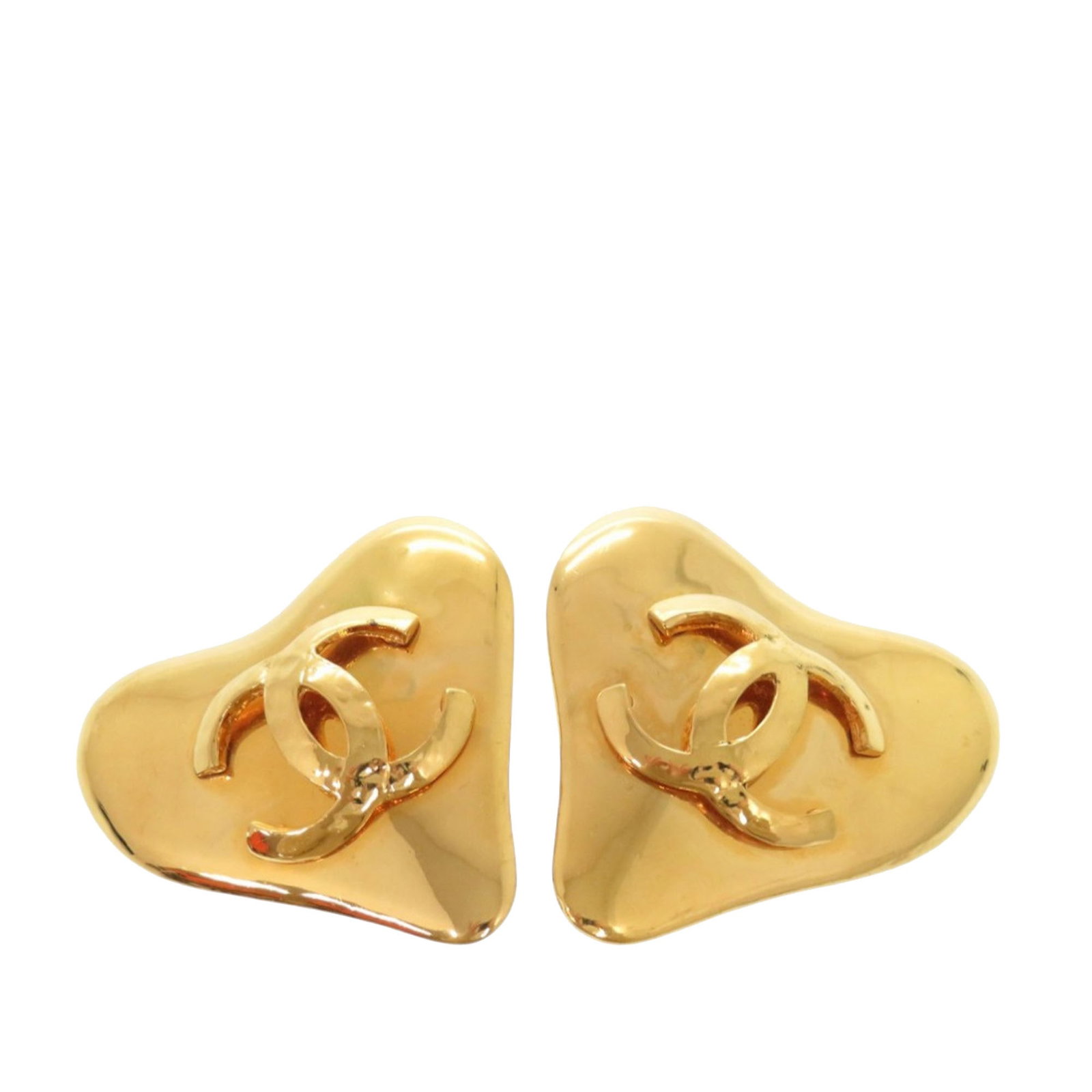 Chanel heart clip on earrings gold plated CC: Chanel heart clip on earrings gold plated CC These Chanel CC Heart earrings are crafted from gold-plated metal and feature a distinctive heart-shaped design with clip-on closures. Made in France, thes