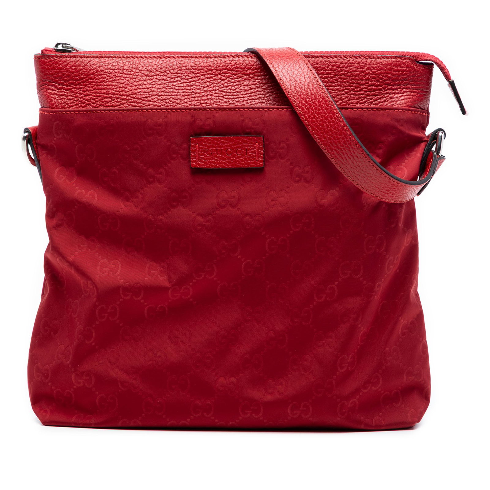 Gucci GG Nylon Red Crossbody Messenger Bag: Gucci GG Nylon Red Crossbody Messenger Bag This Gucci GG Nylon Flat Messenger Bag is crafted from durable nylon with leather trim and features an adjustable flat leather strap. The bag is designed wit