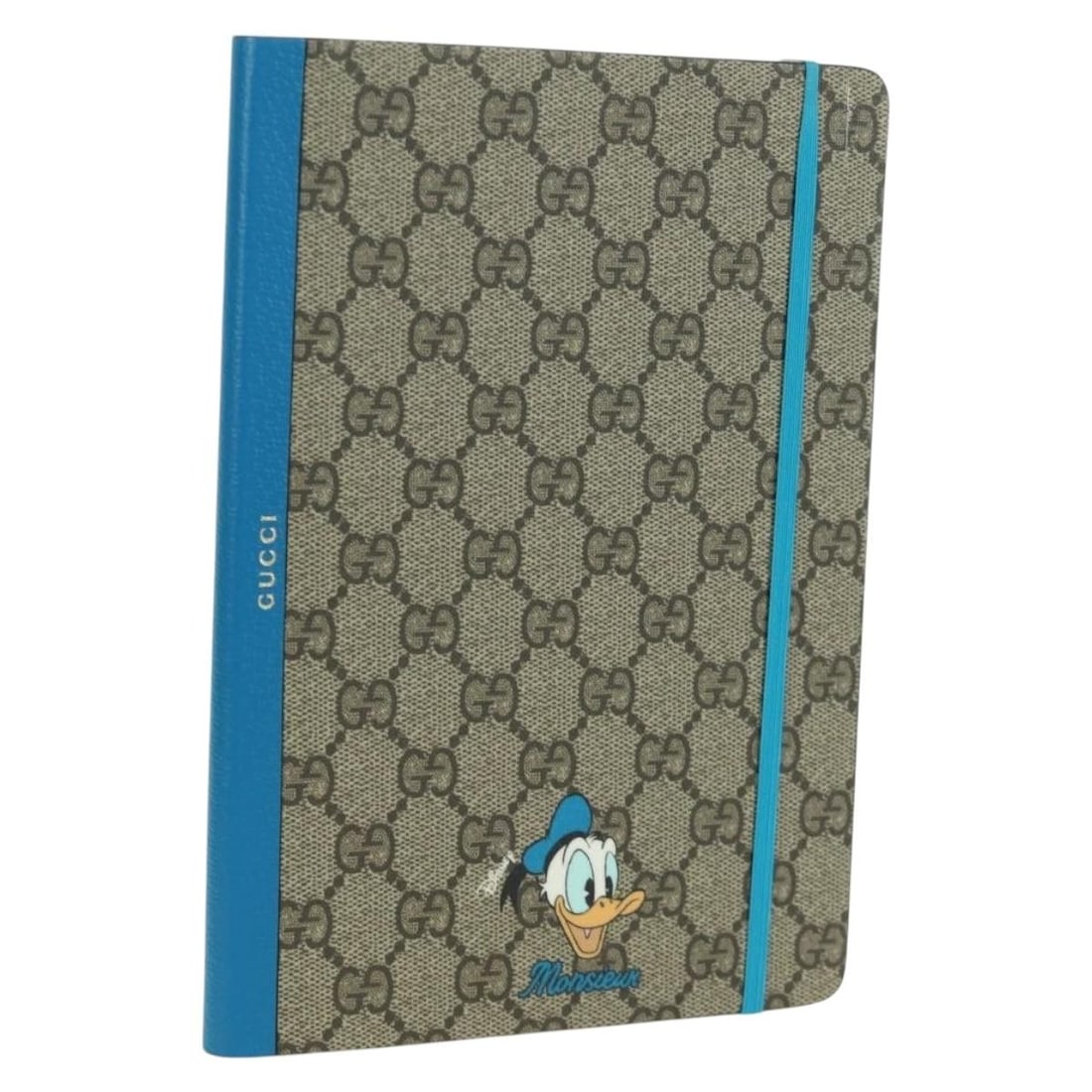 Gucci Beige GG Supreme PVC Donald Duck Stationery Planner with Accessories: Gucci Beige GG Supreme PVC Donald Duck Stationery Planner with Accessories This is an un-used Gucci GG Supreme Donald planner crafted from beige PVC leather and GG canvas. Designed for women, it featu