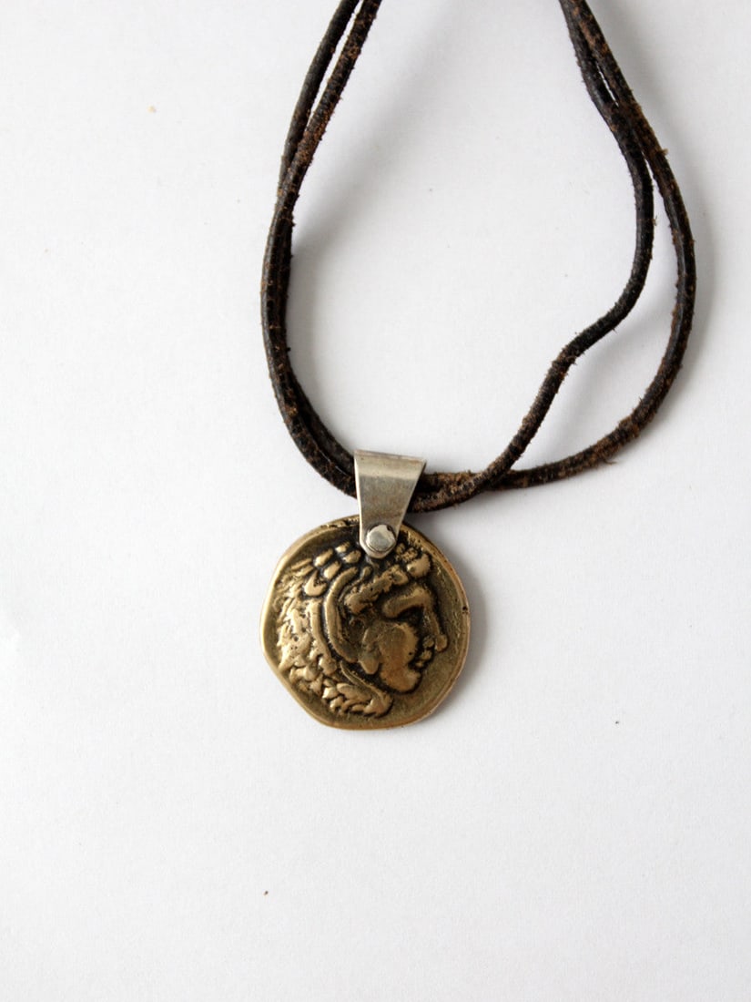 Vintage Alexander the Great Coin Pendant Necklace: Vintage Alexander the Great Coin Pendant Necklace Discover a unique piece from our Stylist's Collection: a vintage necklace featuring an ancient coin of Alexander the Great. The coin has been elegantl
