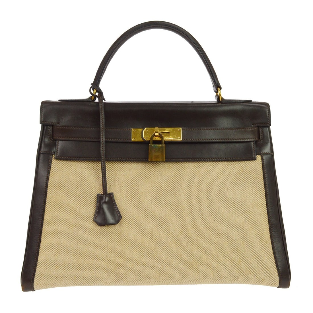 Hermes Kelly 32 Brown Box Calf Canvas Leather Satchel: Hermes Kelly 32 Brown Box Calf Canvas Leather Satchel This Hermes Kelly 32 Retourne handbag is crafted from brown box calf leather and canvas, offering a sophisticated and timeless look. The medium-si