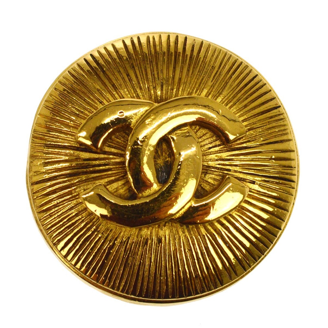Chanel gold logo brooch pin: Chanel gold logo brooch pin This Chanel brooch features the iconic logo design in a gold color, crafted with yellow gold plating. Made in France, it showcases the brand's signature elegance and style.