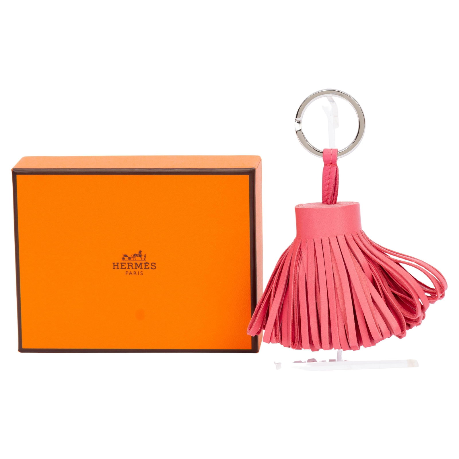 Hermes Carmen pink Milo lambskin key ring in box: Hermes Carmen pink Milo lambskin key ring in box This Hermes Carmen key ring is crafted from pink Milo lambskin and features stainless steel hardware. Made in France, this un-used accessory comes in i