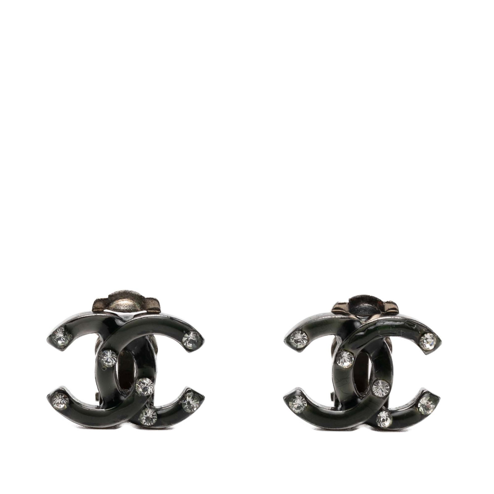 Chanel CC strass lacquered clip on earrings: Chanel CC strass lacquered clip on earrings These Chanel clip-on earrings feature a silver-plated metal construction with lacquered CC logos adorned with strass embellishments. Designed in a black col