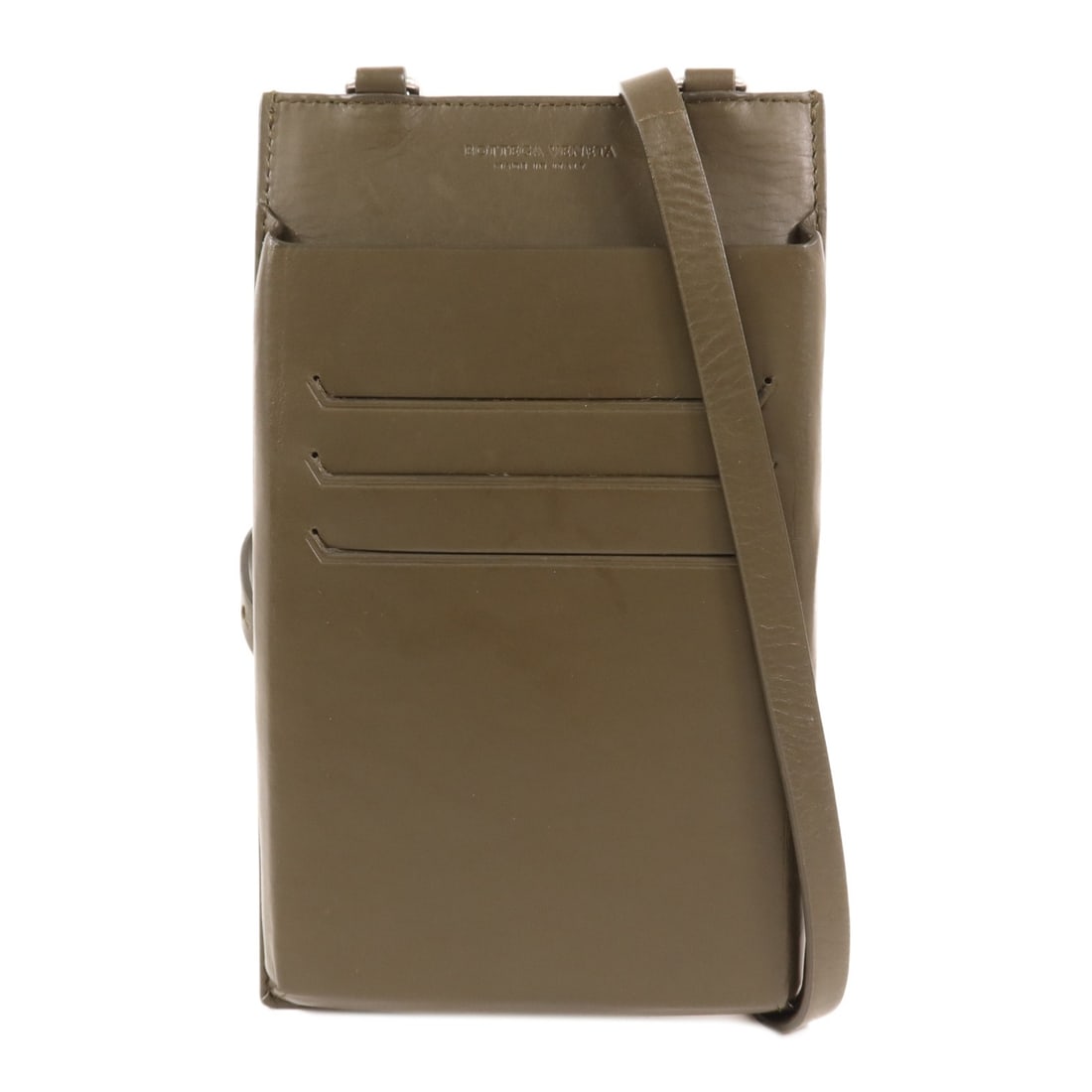 Bottega Veneta Green Leather Phone Shoulder Bag BV SHW: Bottega Veneta Green Leather Phone Shoulder Bag BV SHW This Bottega Veneta shoulder phone bag is crafted from green leather and features a sleek, minimalist design. Made in Italy, it offers a compact 