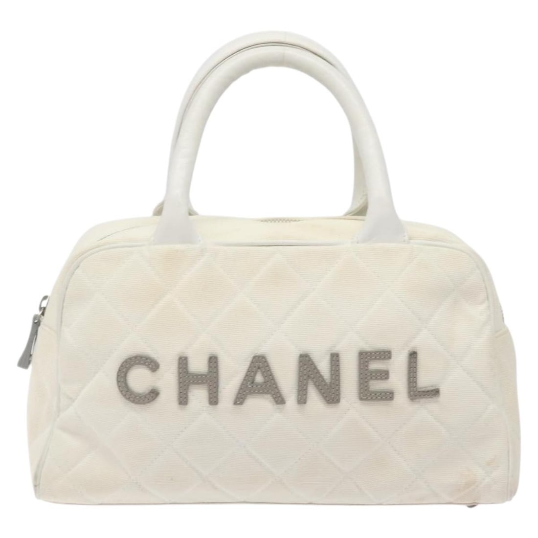 Chanel Vintage Logo Bowler Canvas Bag White 27cm x 15cm x 8cm: Chanel Vintage Logo Bowler Canvas Bag White 27cm x 15cm x 8cm This Chanel Vintage Logo Bowler Bag features a classic quilted canvas design in white. The bag is crafted in Italy and showcases the iconi