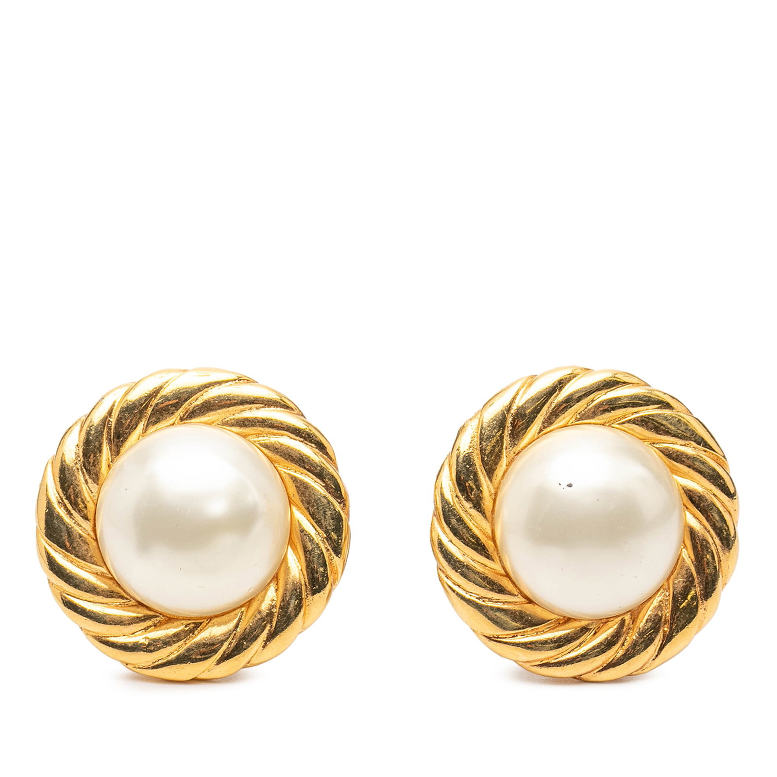 Chanel Clip On Earrings with Gold Tone and Faux Pearl Details: Chanel Clip On Earrings with Gold Tone and Faux Pearl Details These Chanel clip-on earrings feature a round button design with a gold tone metal body and faux pearl detailing. Made in France, these co