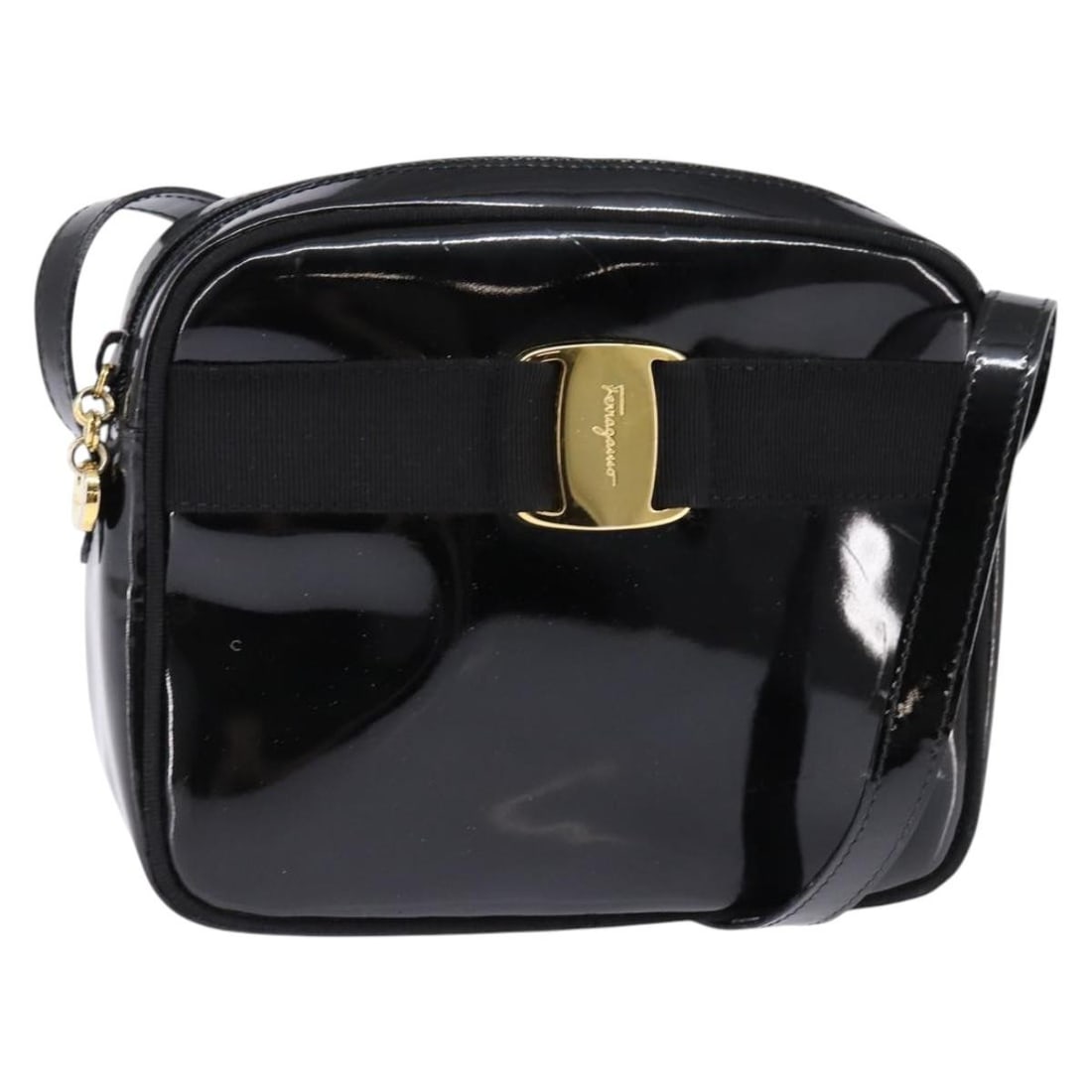 Salvatore Ferragamo Patent Leather Black Vara Bow Shoulder Camera Bag: Salvatore Ferragamo Patent Leather Black Vara Bow Shoulder Camera Bag This Salvatore Ferragamo Vara Bow camera shoulder bag for women features black patent leather construction with a sleek design. It