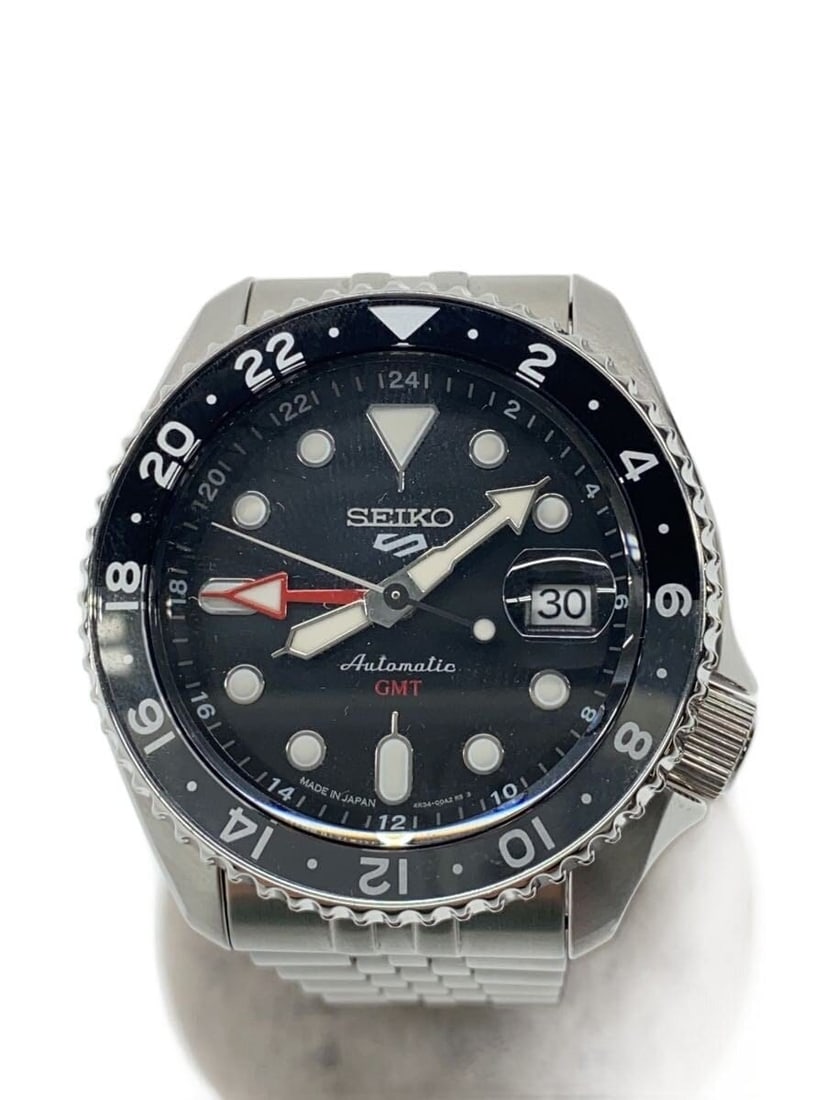 Seiko 5 Sports Mechanical GMT Black Stainless Steel Men's Wristwatch: Seiko 5 Sports Mechanical GMT Black Stainless Steel Men's Wristwatch This SEIKO 5 Sports 4R34-00A0 men's wristwatch features a mechanical GMT movement in a stainless steel case and band. The watch has