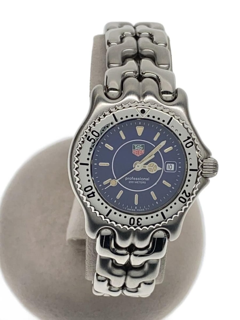 TAG Heuer S le Professional 200m Quartz Steel Men's Wristwatch WG131A: TAG Heuer S le Professional 200m Quartz Steel Men's Wristwatch WG131A This TAG HEUER S/el Professional 200m men's wristwatch features a navy dial and a stainless steel case and band. Designed for dura