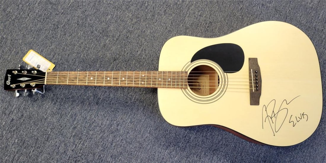 Cort Acoustic Guitar Signed by Austin Butler Elvis Beckett Authenticated: Cort Acoustic Guitar Signed by Austin Butler Elvis Beckett Authenticated This is an original Cort acoustic guitar signed by Austin Butler, known for his role in the movie "Elvis." The autograph has be