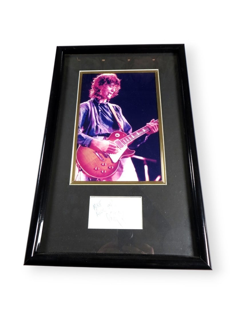 Jimmy Page Signed Framed Cut Signature Photo Led Zeppelin JSA: Jimmy Page Signed Framed Cut Signature Photo Led Zeppelin JSA This stunning framed photograph features a cut signature of Jimmy Page, the iconic guitarist of Led Zeppelin. The piece is authenticated b