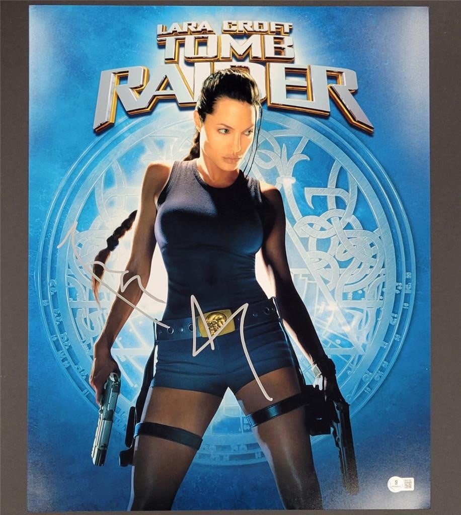 Angelina Jolie Signed Tomb Raider 16x20 Photo Beckett Authenticated: Angelina Jolie Signed Tomb Raider 16x20 Photo Beckett Authenticated This is an original 16x20 photograph from the movie Tomb Raider, featuring the signature of actress Angelina Jolie. The autograph ha