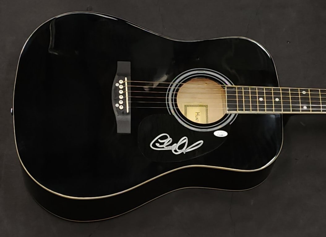 Charlie Daniels JSA Autographed Acoustic Guitar with Pick: Charlie Daniels JSA Autographed Acoustic Guitar with Pick This is a pre-owned acoustic guitar and guitar pick, personally signed by Charlie Daniels. The autograph has been authenticated by James Spenc