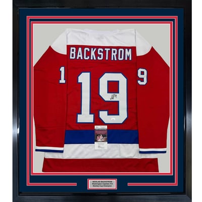 Nicklas Backstrom signed framed red retro jersey JSA COA 35x39: Nicklas Backstrom signed framed red retro jersey JSA COA 35x39 This professionally framed and matted display features a red retro jersey autographed by Nicklas Backstrom. The piece includes two 5x7 ph