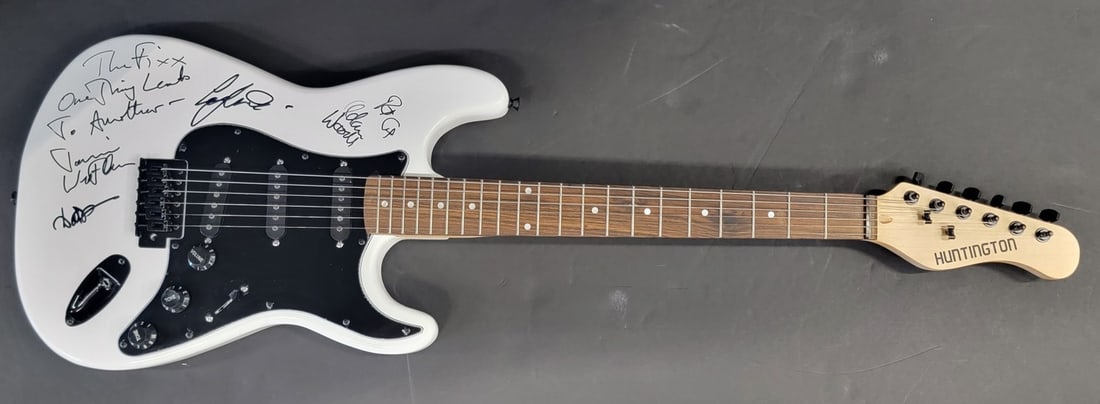 The Fixx Autographed Guitar by Cy Curnin Jamie West Oram JSA: The Fixx Autographed Guitar by Cy Curnin Jamie West Oram JSA This is an authentic autographed guitar featuring signatures from members of the band The Fixx: Cy Curnin, Jamie West Oram, Adam Woods, Rup