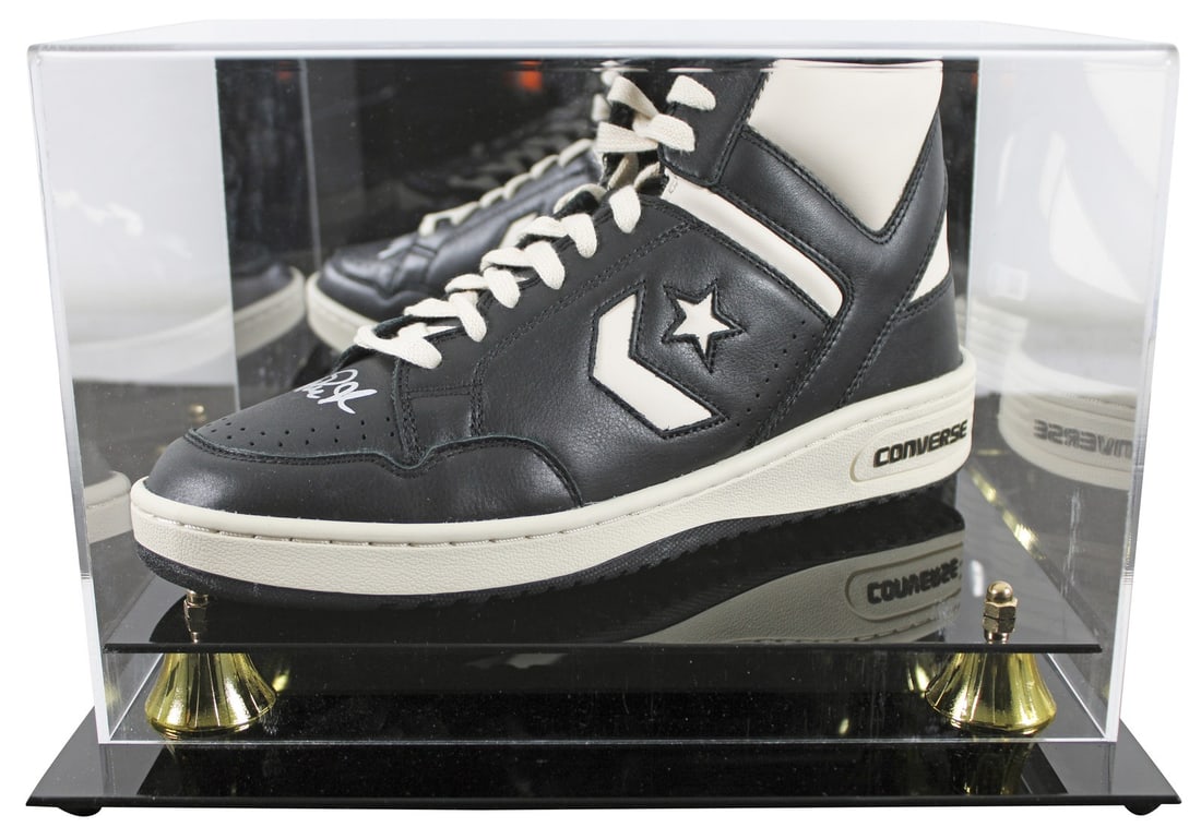 Magic Johnson Signed Converse Weapon Shoe with Beckett Authentication: Magic Johnson Signed Converse Weapon Shoe with Beckett Authentication This authentic left black and white Converse Weapon shoe, personally signed by Magic Johnson of the Los Angeles Lakers, is a remar