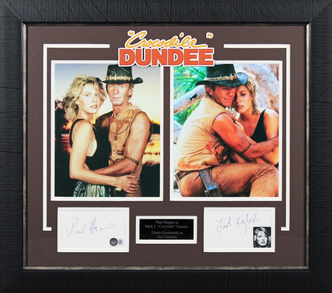 Crocodile Dundee Signed Display by Paul Hogan & Linda Kozlowski Beckett Authenticated: Crocodile Dundee Signed Display by Paul Hogan & Linda Kozlowski Beckett Authenticated This stunning framed display features a signed 3x5 index card personally autographed by Paul Hogan and Linda Kozlo