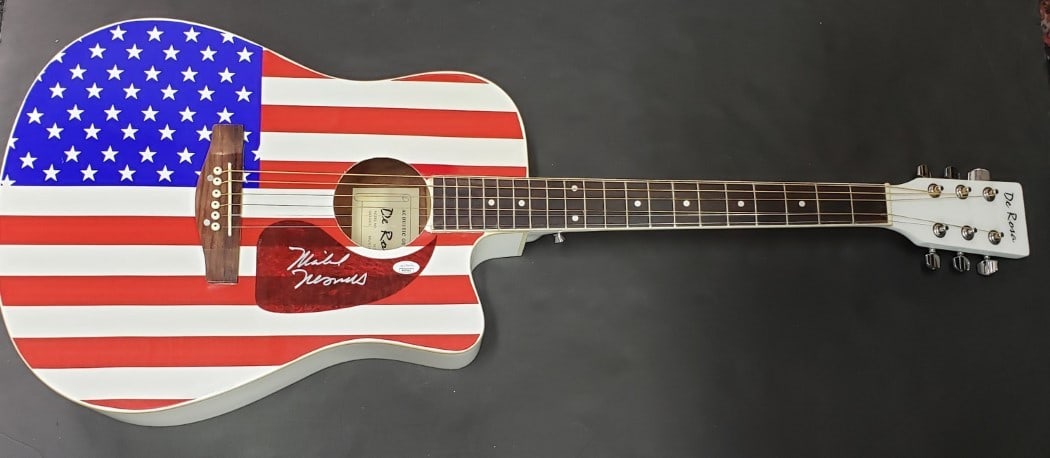 Mike Nesmith Autographed USA Guitar JSA: Mike Nesmith Autographed USA Guitar JSA This is an original guitar and guitar pick autographed by Mike Nesmith, the renowned pop star from The Monkees. The authenticity of the signature is verified by