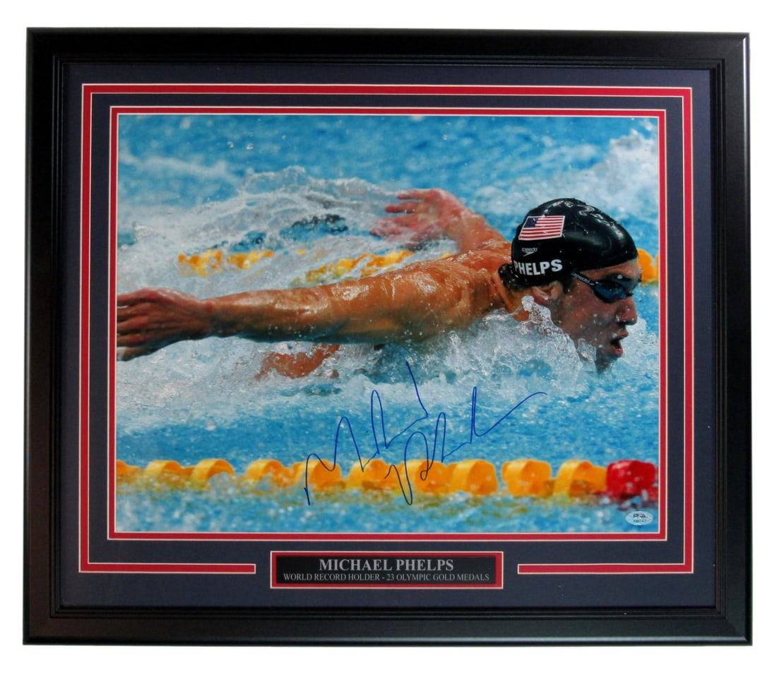 Framed 16x20 Photo Signed by Michael Phelps with PSA DNA Authentication: Framed 16x20 Photo Signed by Michael Phelps with PSA DNA Authentication This professionally framed 16x20 photograph features the authentic signature of Michael Phelps, the Olympic gold medal swimmer. 