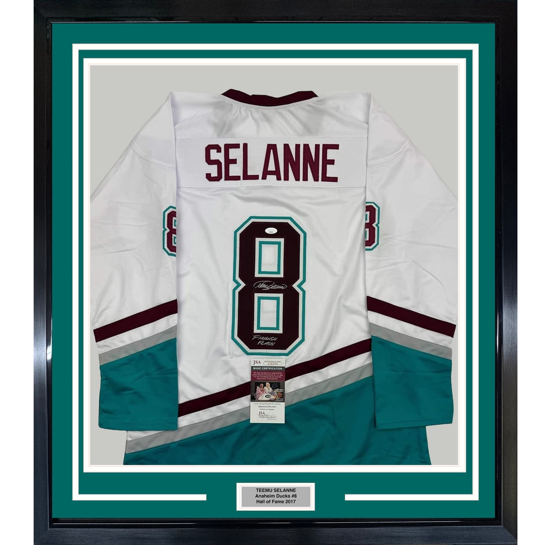 Teemu Selanne Signed 35x39 Framed White Jersey With JSA Authentication: Teemu Selanne Signed 35x39 Framed White Jersey With JSA Authentication This professionally framed and matted display features an autographed white jersey signed by Teemu Selanne, known as the "Finnish