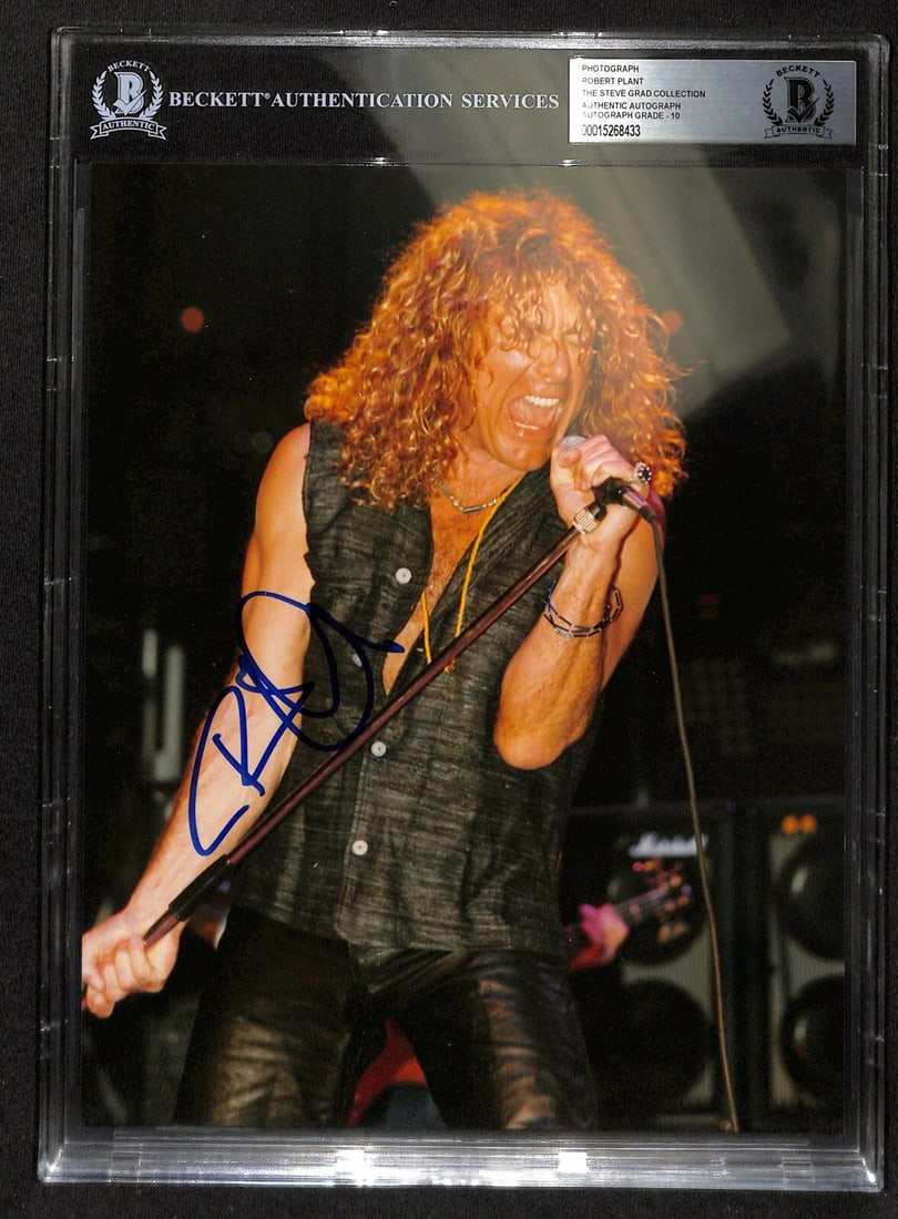 Robert Plant Signed 8X10 Photo Auto Grade 10 Beckett Authentic: Robert Plant Signed 8X10 Photo Auto Grade 10 Beckett Authentic This stunning 8X10 photograph features Robert Plant of Led Zeppelin, personally signed in blue permanent marker. The autograph is authent