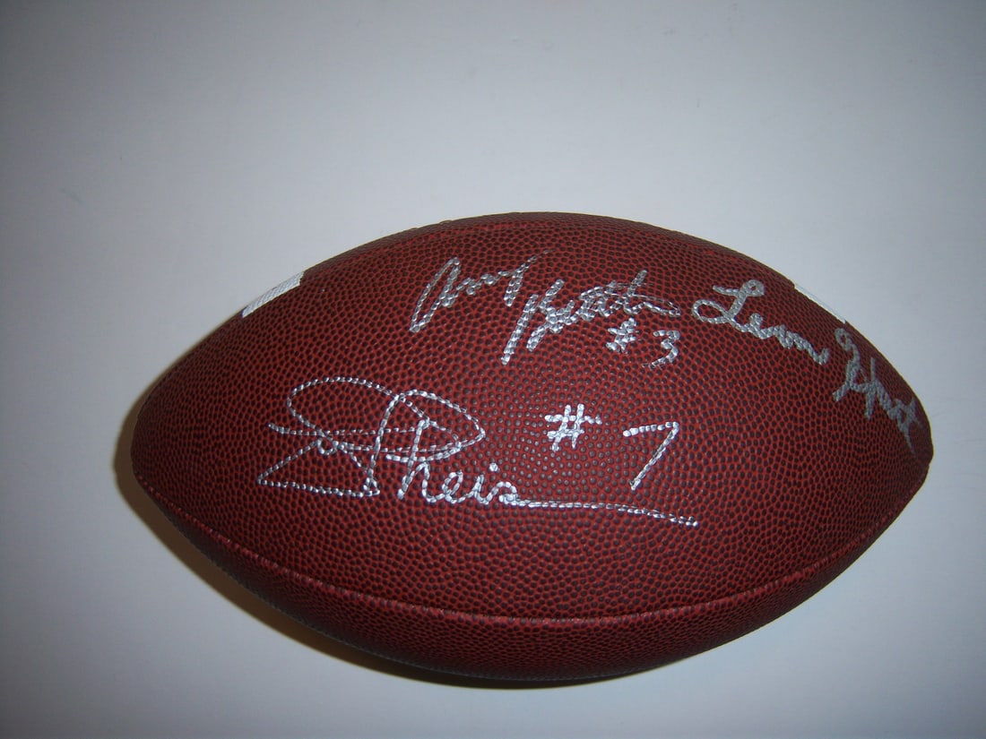 Autographed Football With COA Signed By Hart Theismann Hornung Beuerlein: Autographed Football With COA Signed By Hart Theismann Hornung Beuerlein This football is signed by Leon Hart, Joe Theismann, Paul Hornung, and Steve Beuerlein, representing prominent figures associat