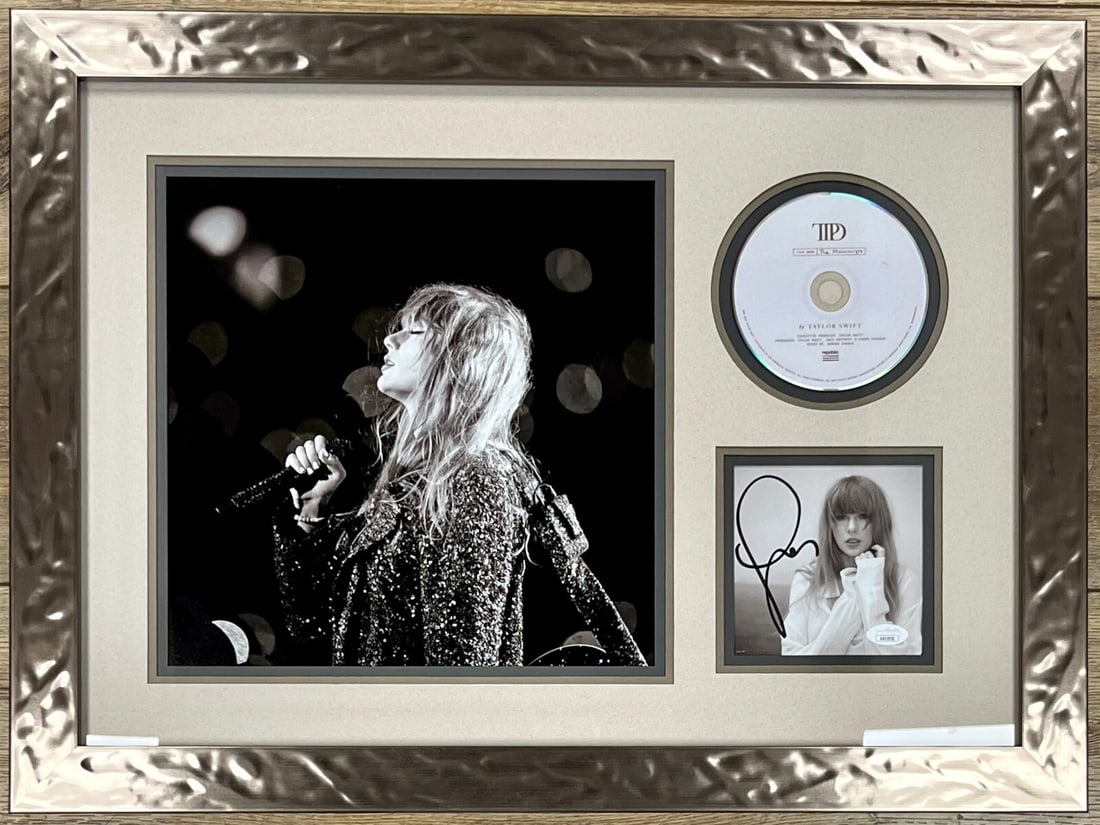 Taylor Swift Signed Tortured Poets CD Insert Custom Framed JSA Authenticated Display: Taylor Swift Signed Tortured Poets CD Insert Custom Framed JSA Authenticated Display This stunning custom framed display features a signed CD insert of 'Tortured Poets' by pop superstar Taylor Swift. 