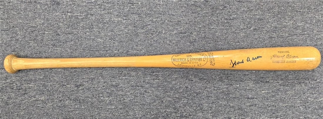Louisville Slugger Bat Signed by Hank Aaron with JSA Authentication: Louisville Slugger Bat Signed by Hank Aaron with JSA Authentication This Louisville Slugger Game Model bat features the autograph of legendary baseball player Henry Hank Aaron. Authenticated by James 
