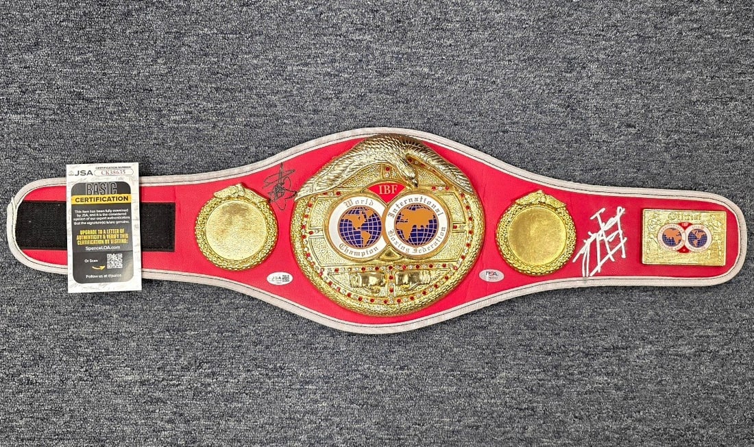 Mini IBF Boxing Champion Belt Signed by Naoya Inoue and Junto Nakatani JSA: Mini IBF Boxing Champion Belt Signed by Naoya Inoue and Junto Nakatani JSA This mini IBF boxing championship belt has been signed by Naoya Inoue and Junto Nakatani. The autographs have been authentica