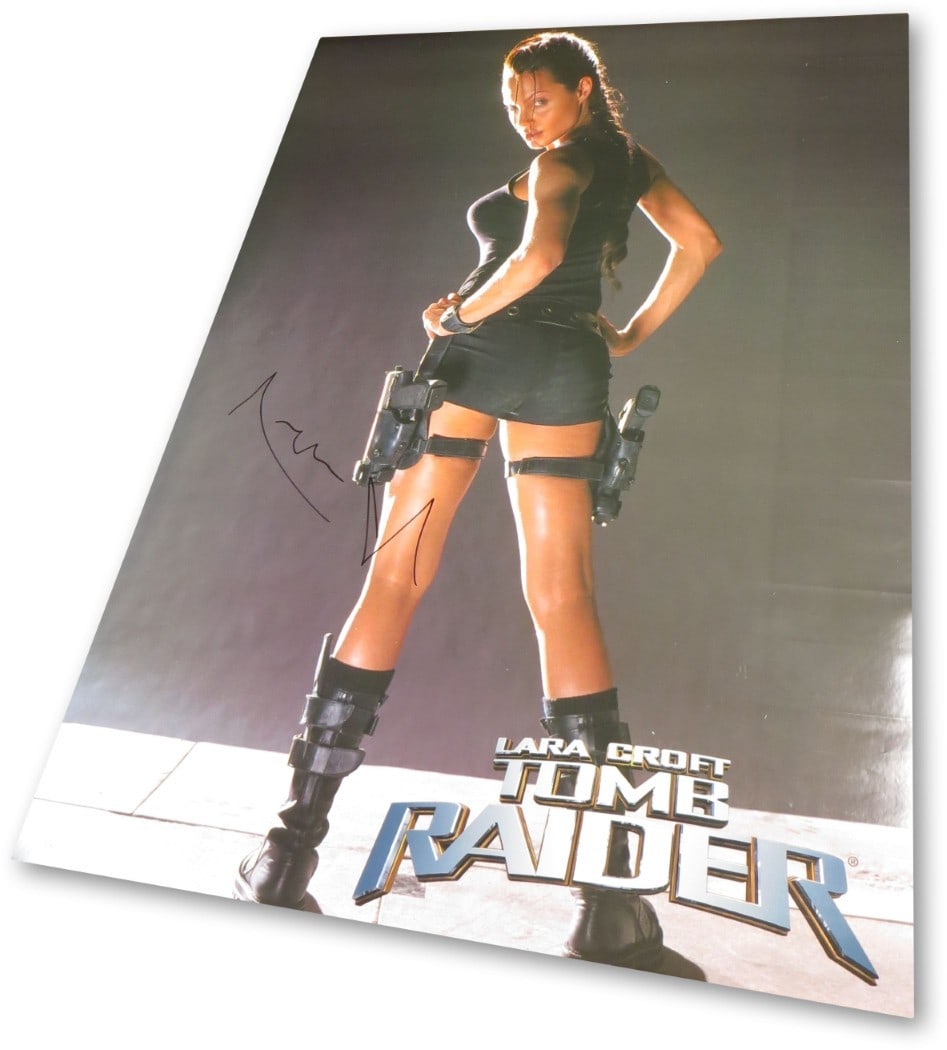 Angelina Jolie Autographed 27x38 Tomb Raider Poster JSA Authenticated: Angelina Jolie Autographed 27x38 Tomb Raider Poster JSA Authenticated This original 27X38 poster features an authentic autograph from Angelina Jolie, renowned for her role in Tomb Raider. The signatur
