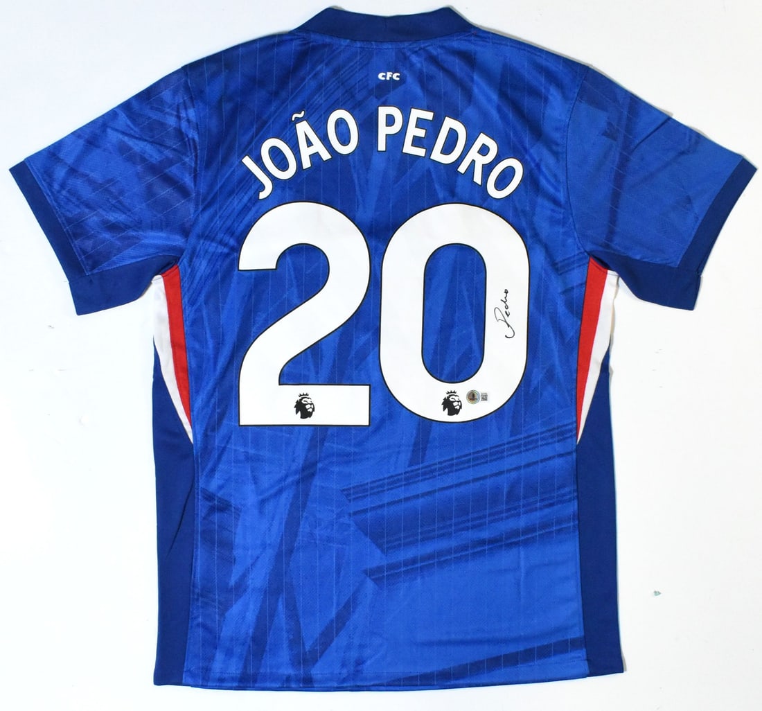 Chelsea FC Home Jersey Signed by Joao Pedro Beckett Hologram: Chelsea FC Home Jersey Signed by Joao Pedro Beckett Hologram This is an original Chelsea FC home soccer jersey featuring the number 20, autographed by Joao Pedro. The jersey is pre-owned and comes wit