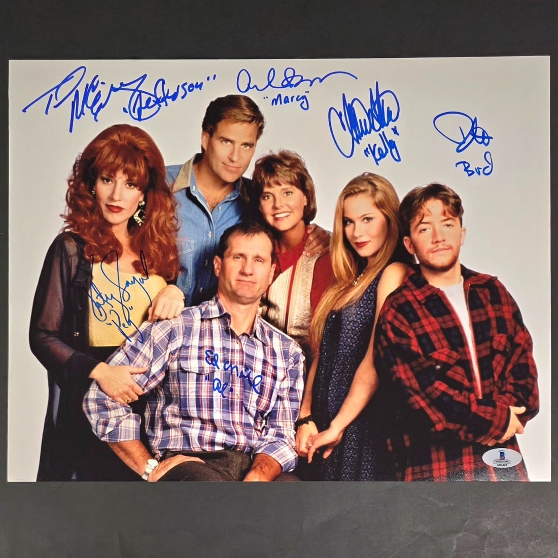 Signed Married With Children Cast Photo 11x14 Ed O'Neill Beckett Auth: Signed Married With Children Cast Photo 11x14 Ed O'Neill Beckett Auth This is an 11x14 photo featuring the cast of the iconic show "Married With Children," personally signed by Ed O'Neill. The photo i