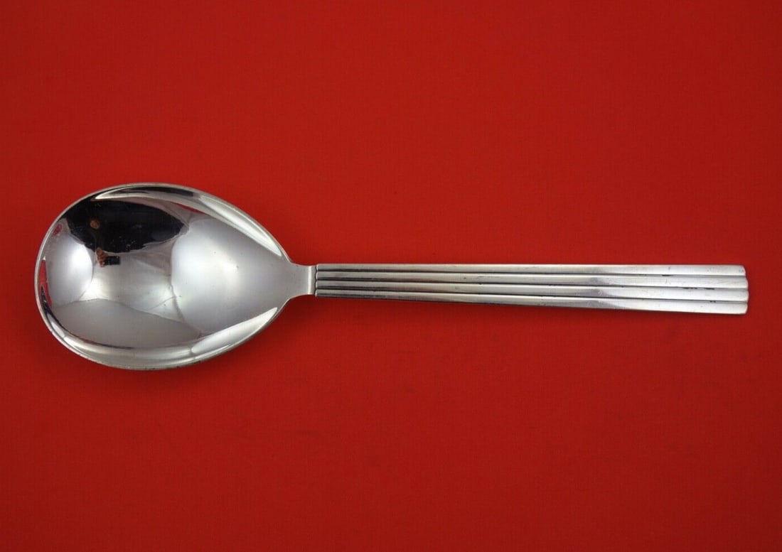 Georg Jensen Bernadotte Sterling Silver Serving Spoon 10 1/2": Georg Jensen Bernadotte Sterling Silver Serving Spoon 10 1/2" Enhance your dining experience with this exquisite Bernadotte vegetable serving spoon by Georg Jensen. Crafted from high-quality sterling 