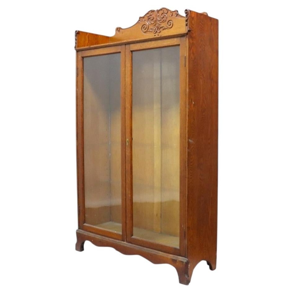Antique carved oak glass door bookcase attributed to R.J. Horner (1 of 14)