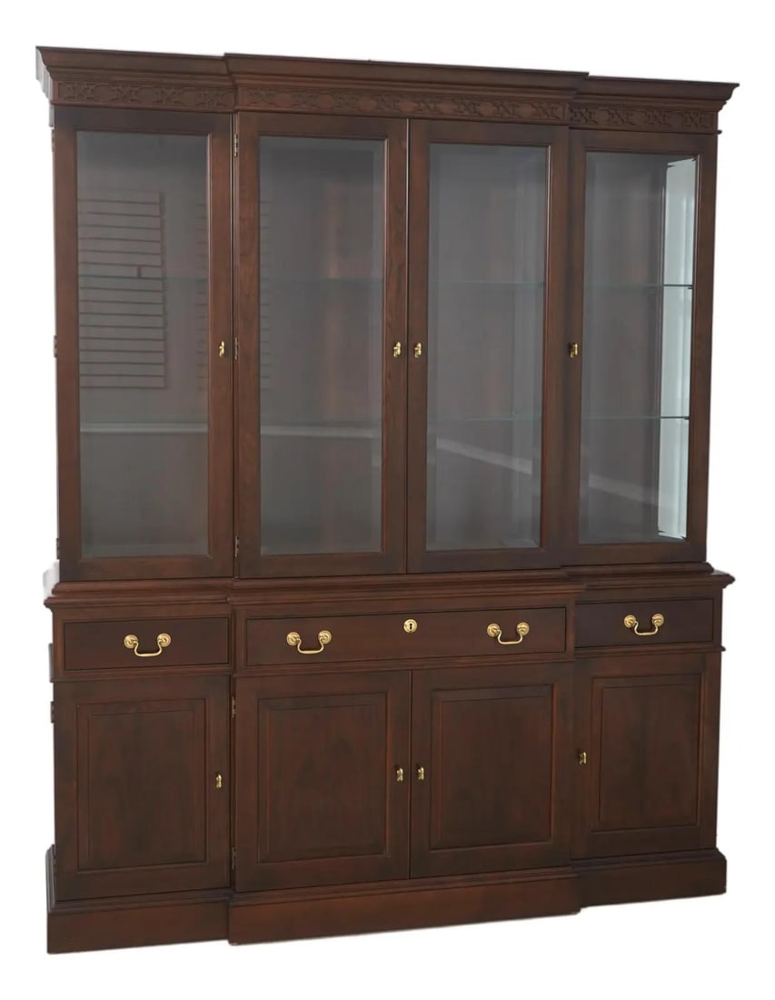 Cherry Wood China Cabinet with Beveled Glass and Brass Hardware: Cherry Wood China Cabinet with Beveled Glass and Brass Hardware This Stickley breakfront china cabinet features a classic traditional design crafted from cherry wood with a brown finish (Finish No. 14