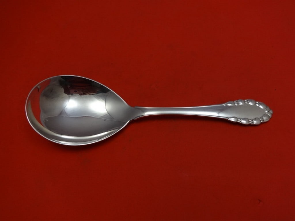 Georg Jensen Lily of the Valley Sterling Silver Berry Spoon 8 7/8": Georg Jensen Lily of the Valley Sterling Silver Berry Spoon 8 7/8" This exquisite serving spoon features the elegant Lily of the Valley pattern by Georg Jensen. Crafted from high-quality sterling silv