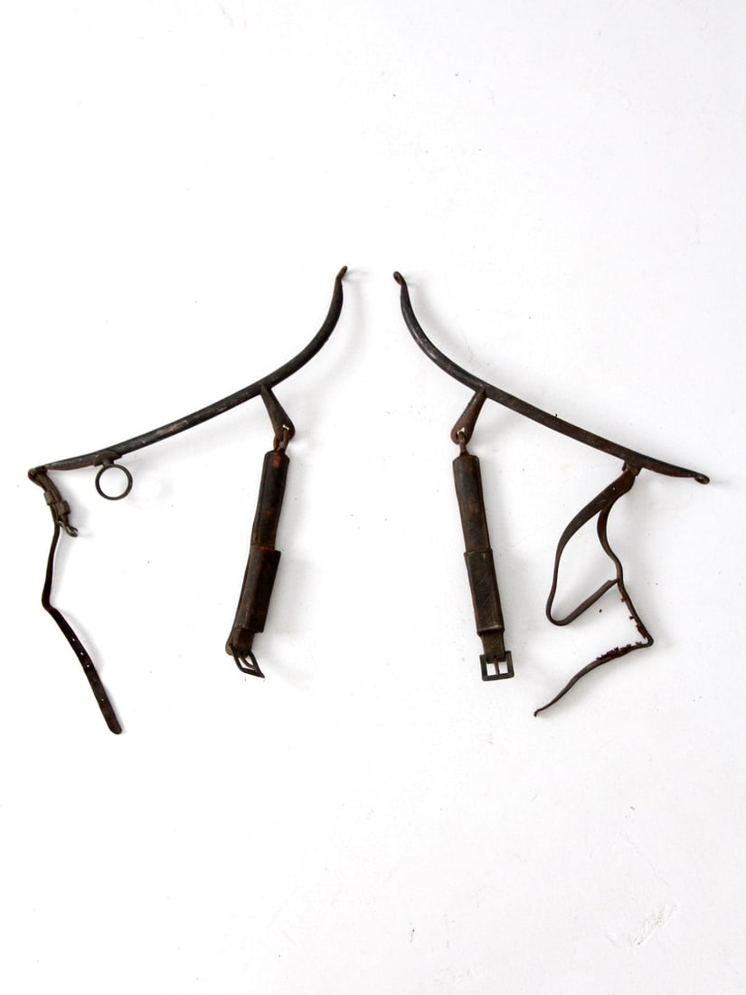 Antique Horse Hames Equestrian Tack with Leather Straps: Antique Horse Hames Equestrian Tack with Leather Straps Discover this stunning set of antique horse hames, a remarkable piece of equestrian history. These black metal bars were integral to a horse yok