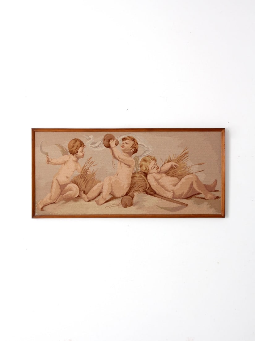 Vintage Framed Needlepoint Wall Hanging with Cherubs: Vintage Framed Needlepoint Wall Hanging with Cherubs This charming vintage wall hanging features a beautifully framed needlepoint depicting three playful cherubs, masterfully hand-stitched to capture 